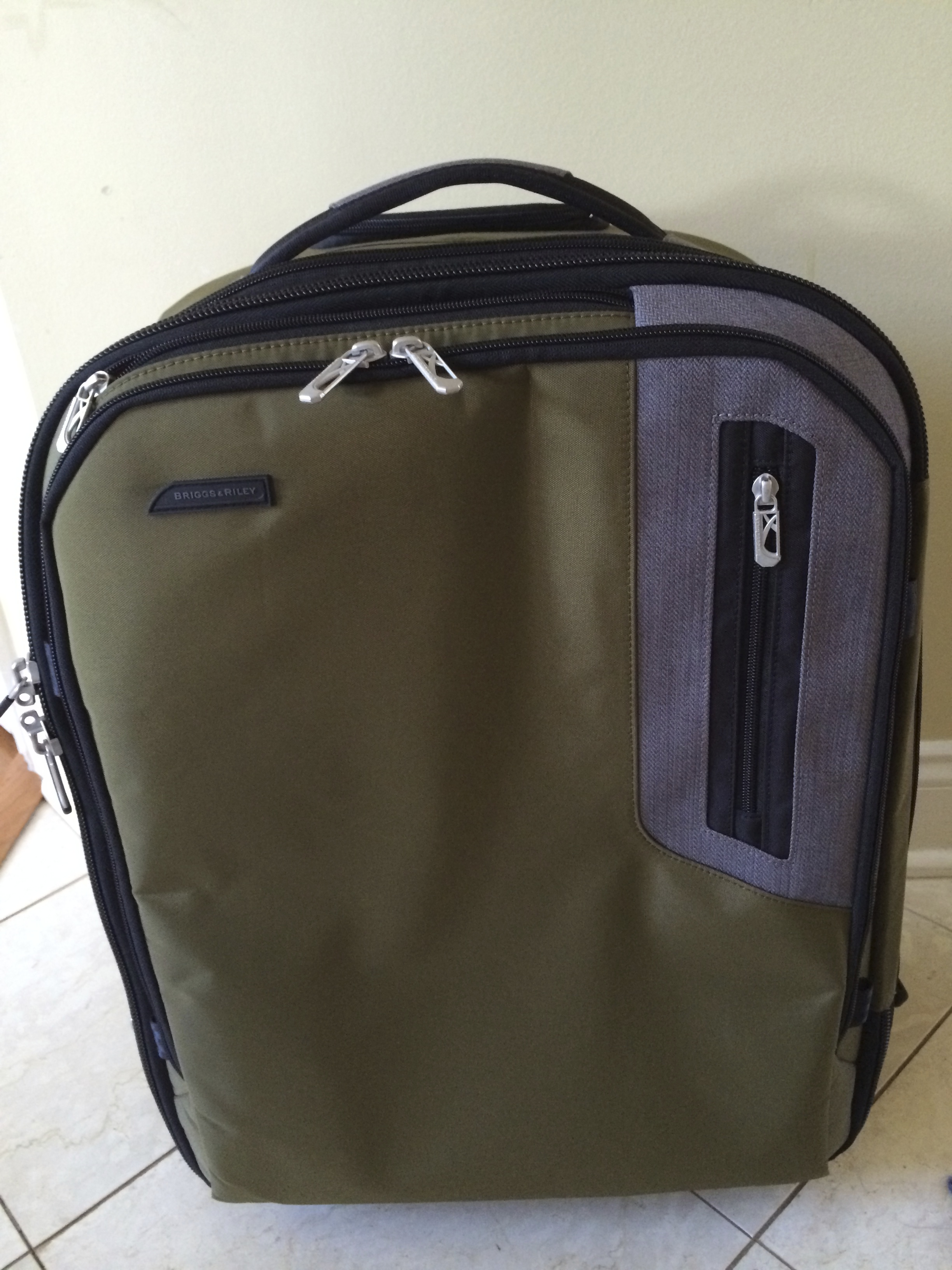 a green and grey suitcase