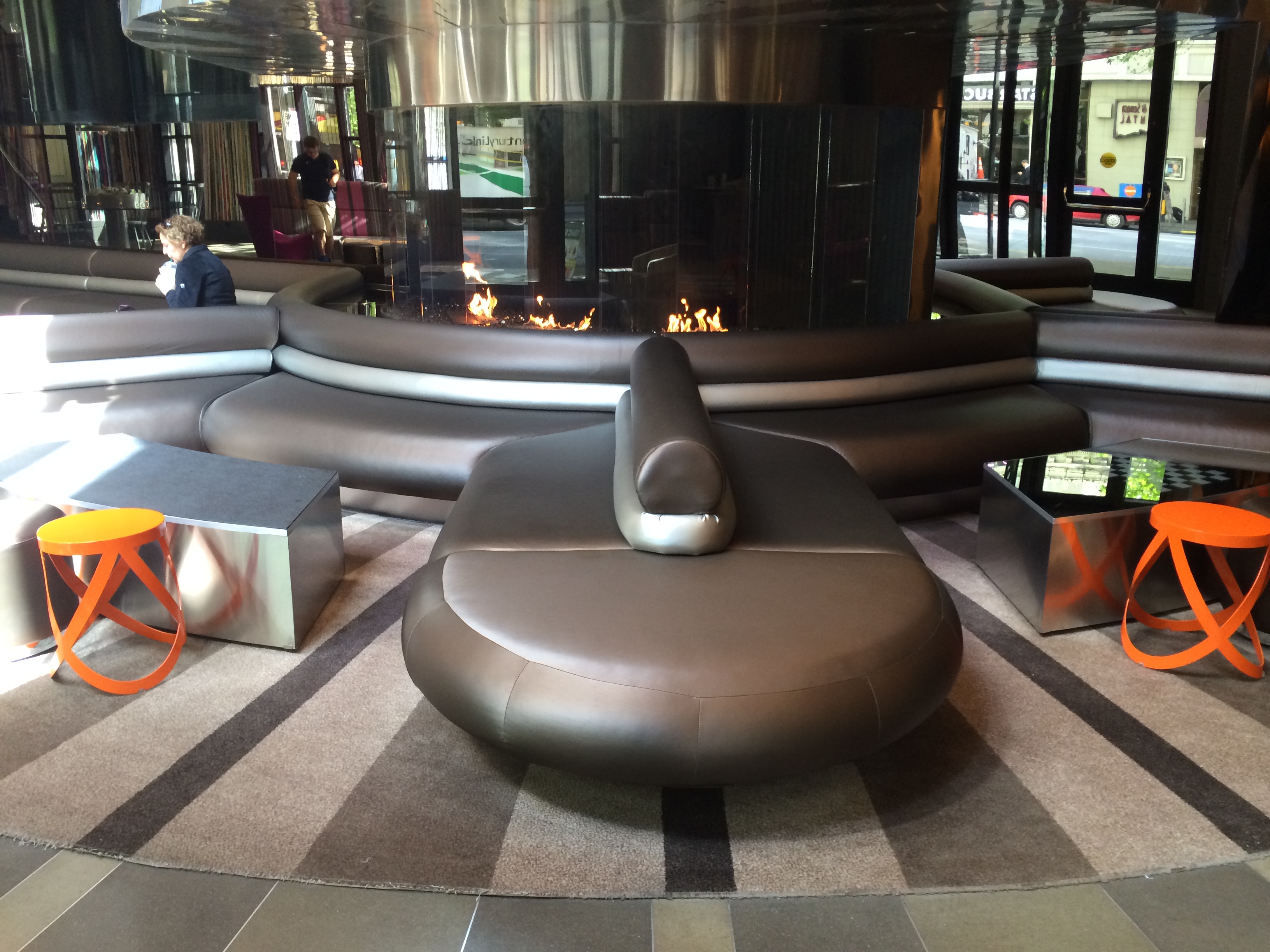 a large round couch in a lobby