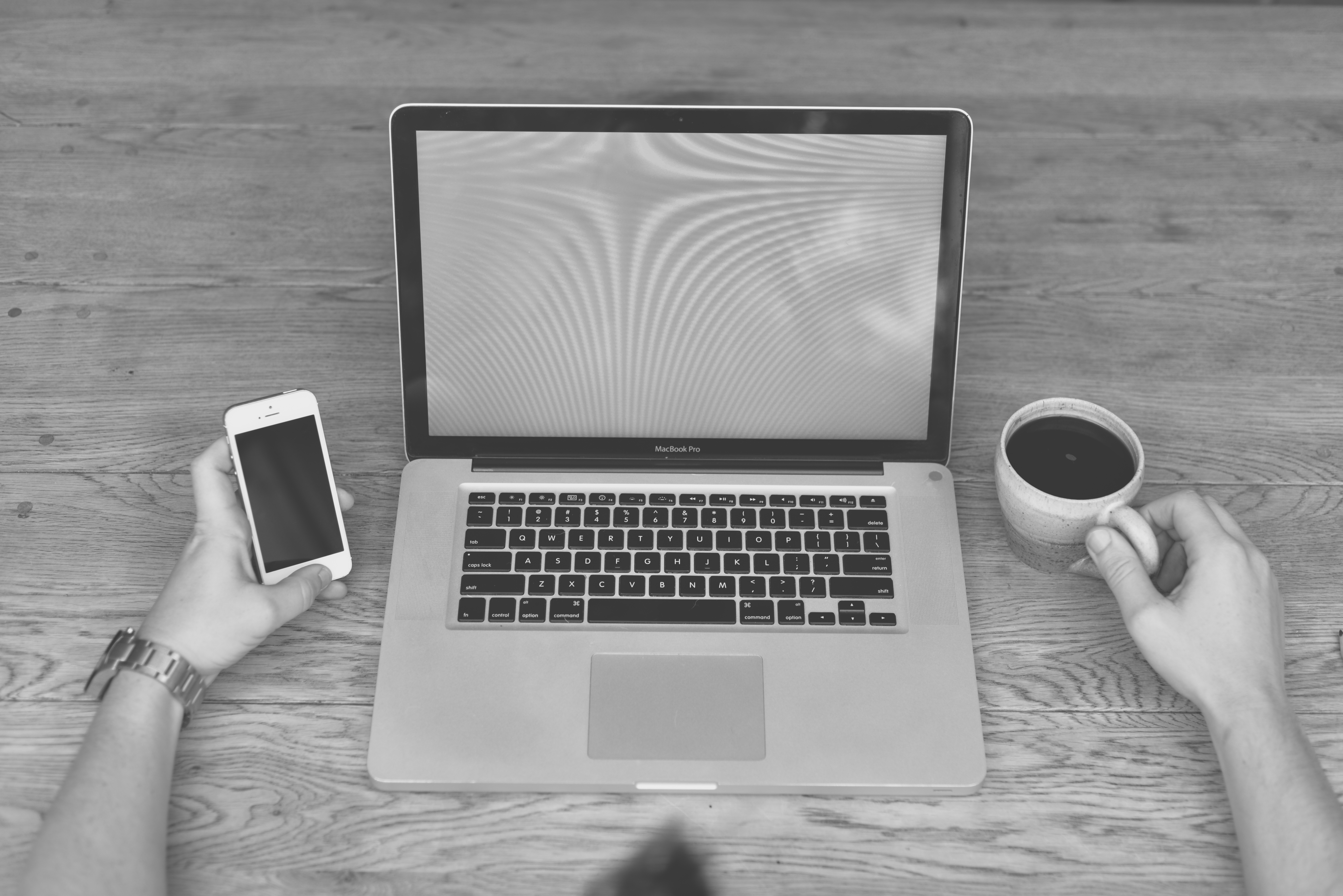 a laptop and phone on a table