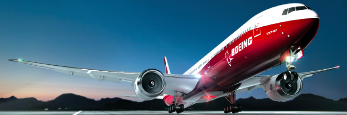a red and white airplane on runway