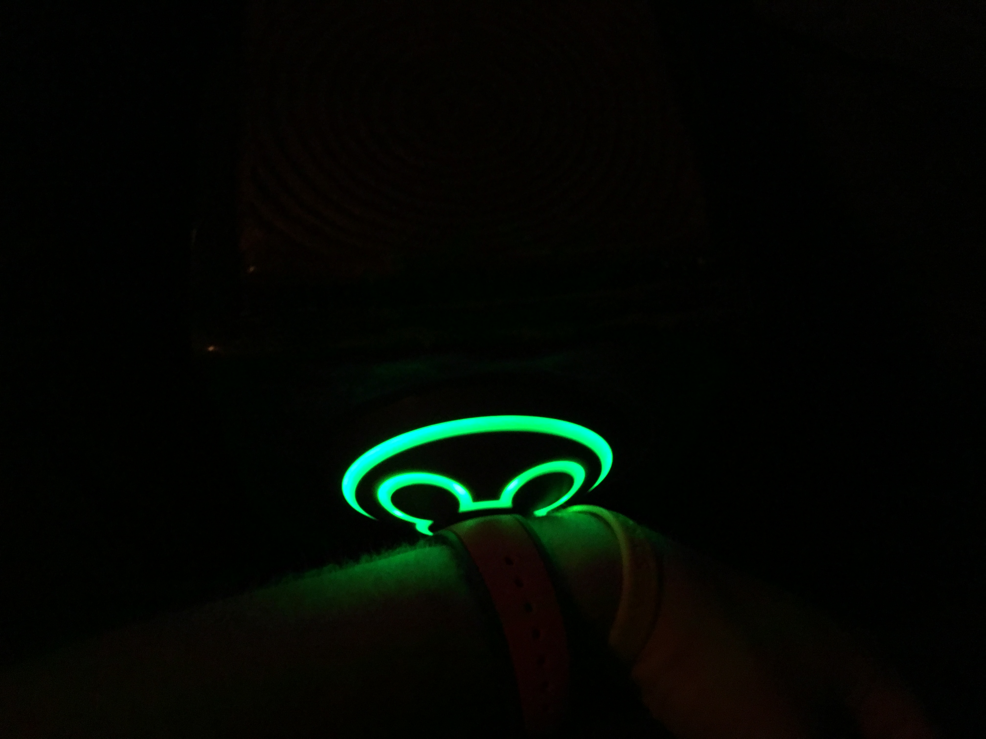 a green light on a wrist watch