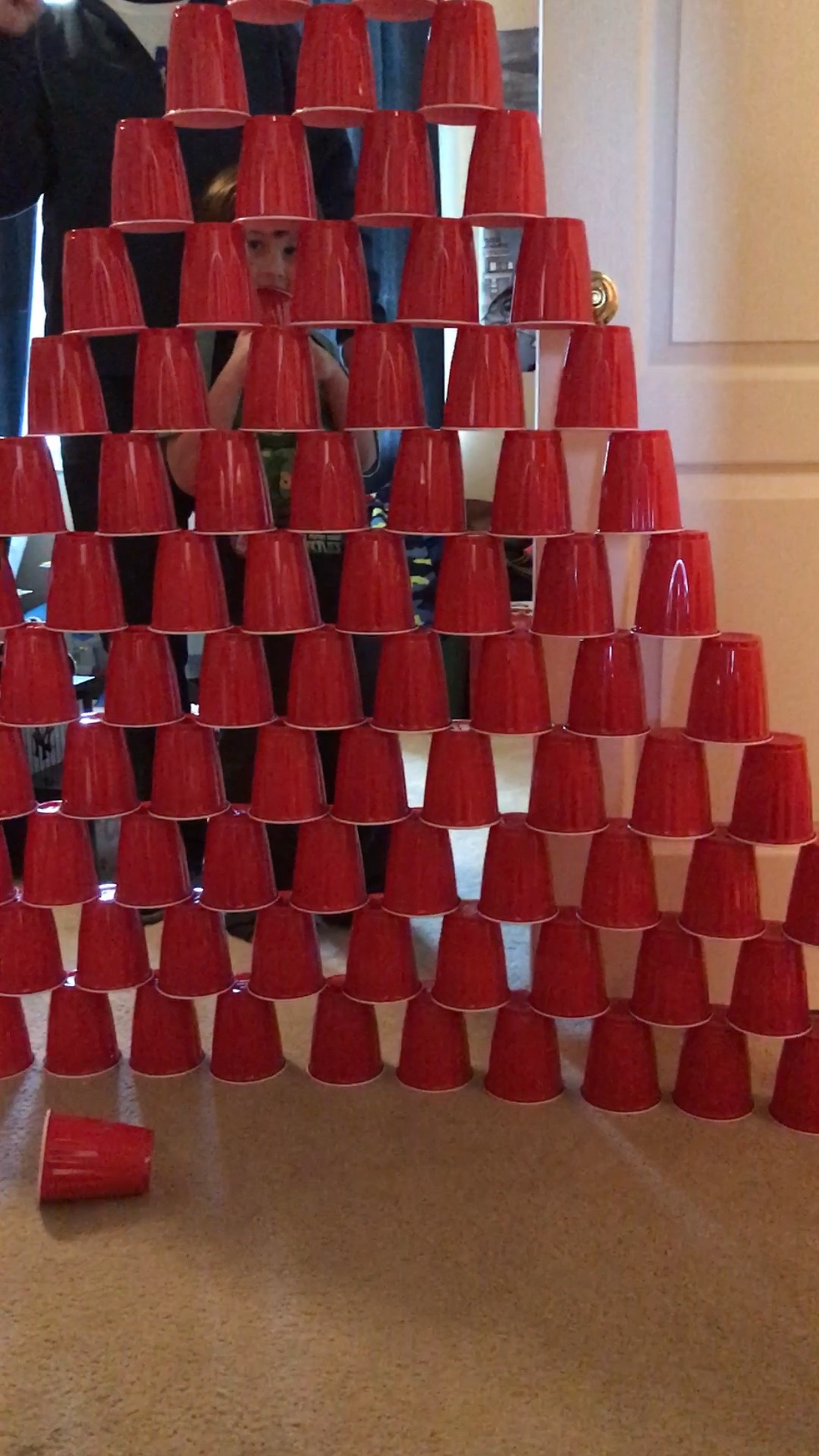 a pyramid of red cups
