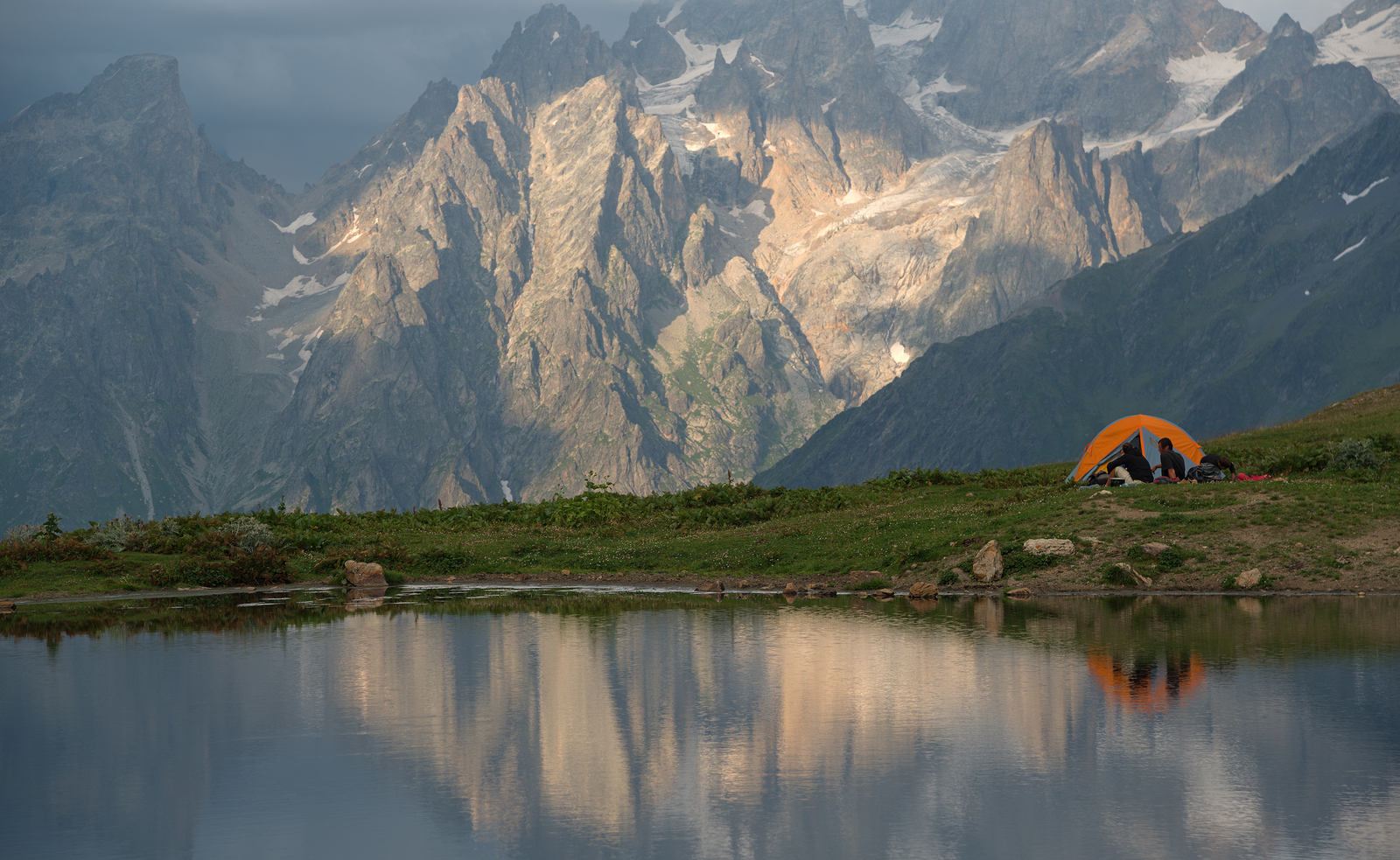a tent next to a lake