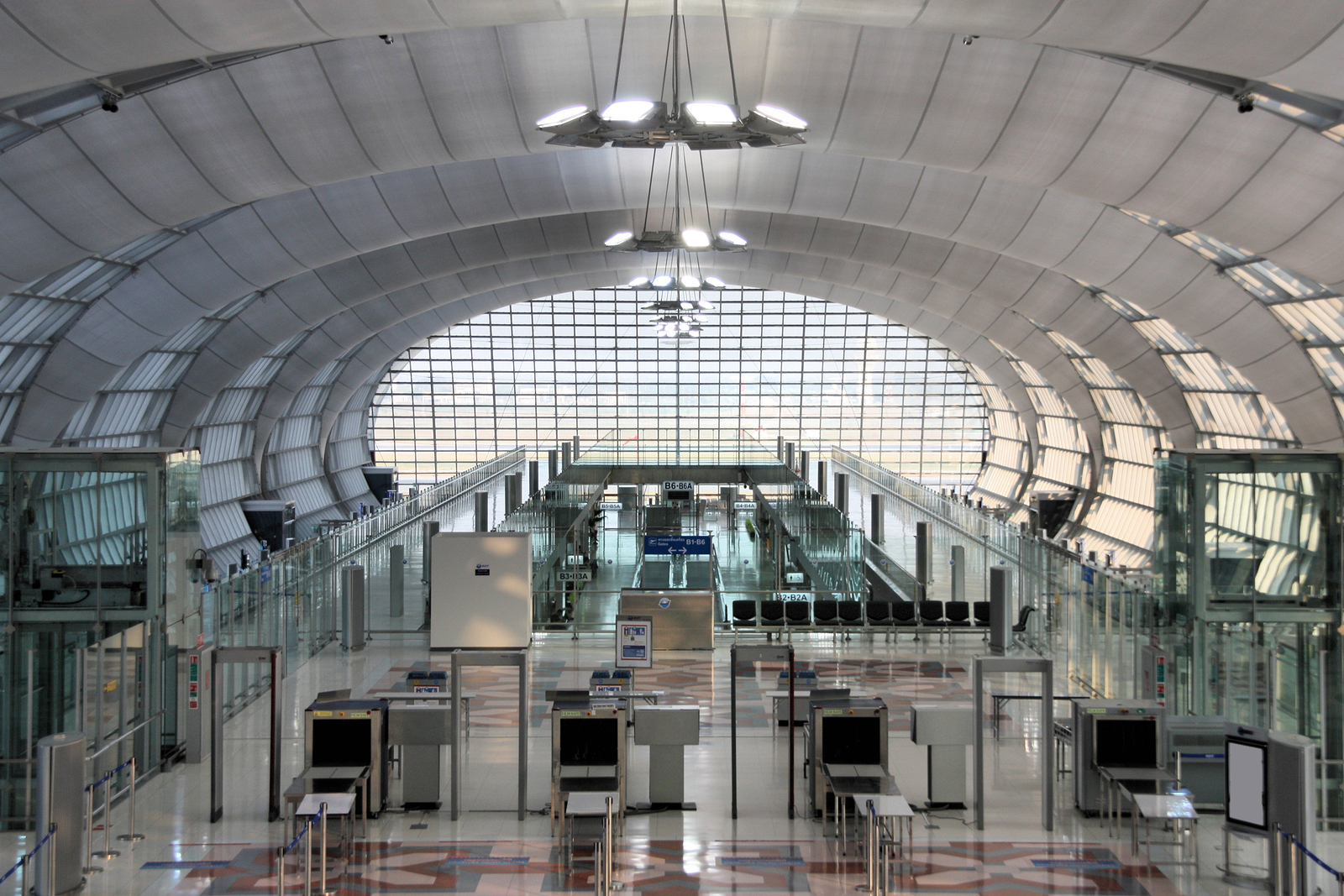 an airport with a large glass ceiling