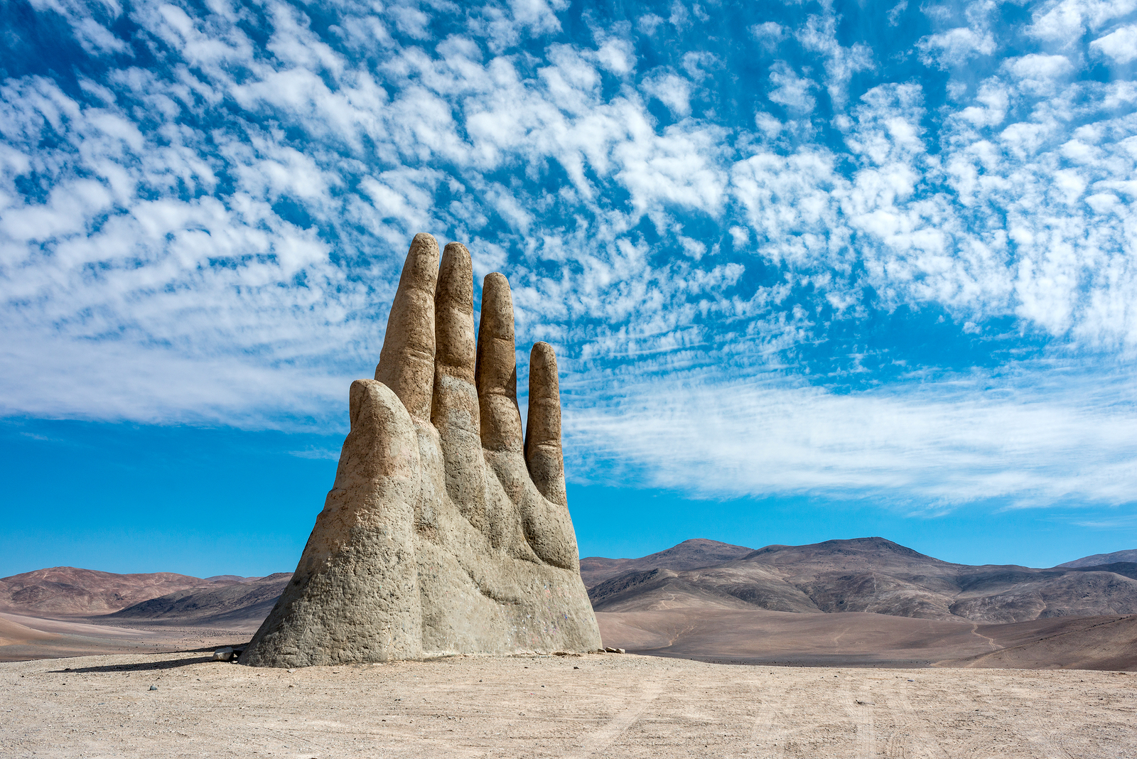 a large rock sculpture of a hand