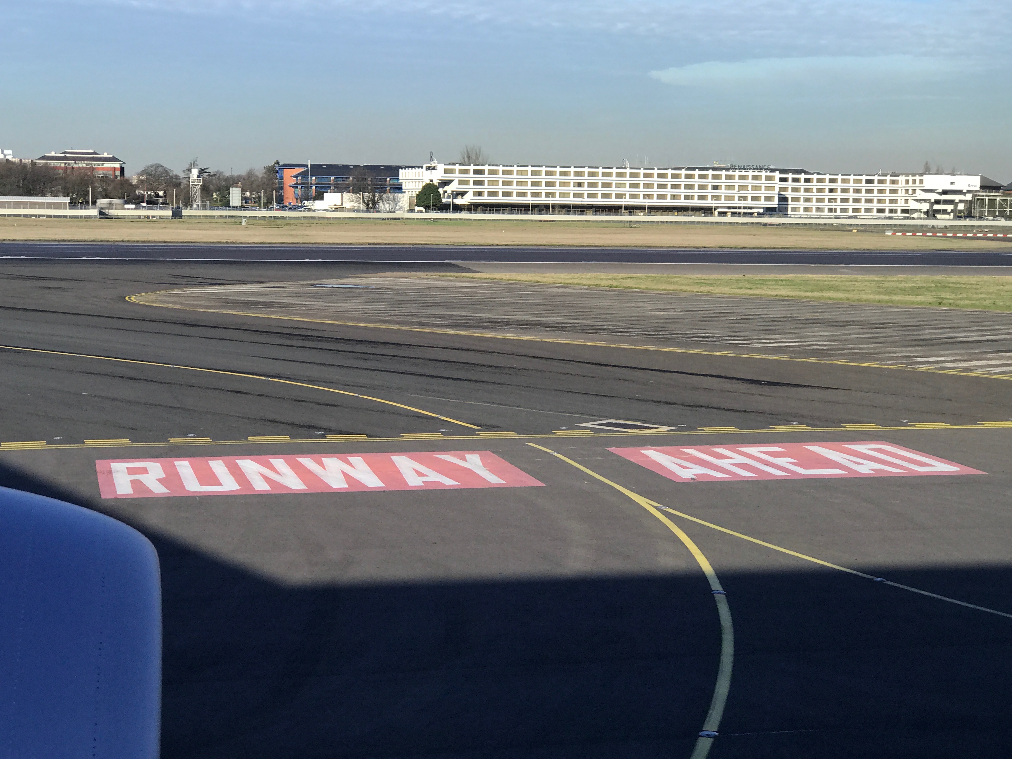 a runway and runway sign on a runway