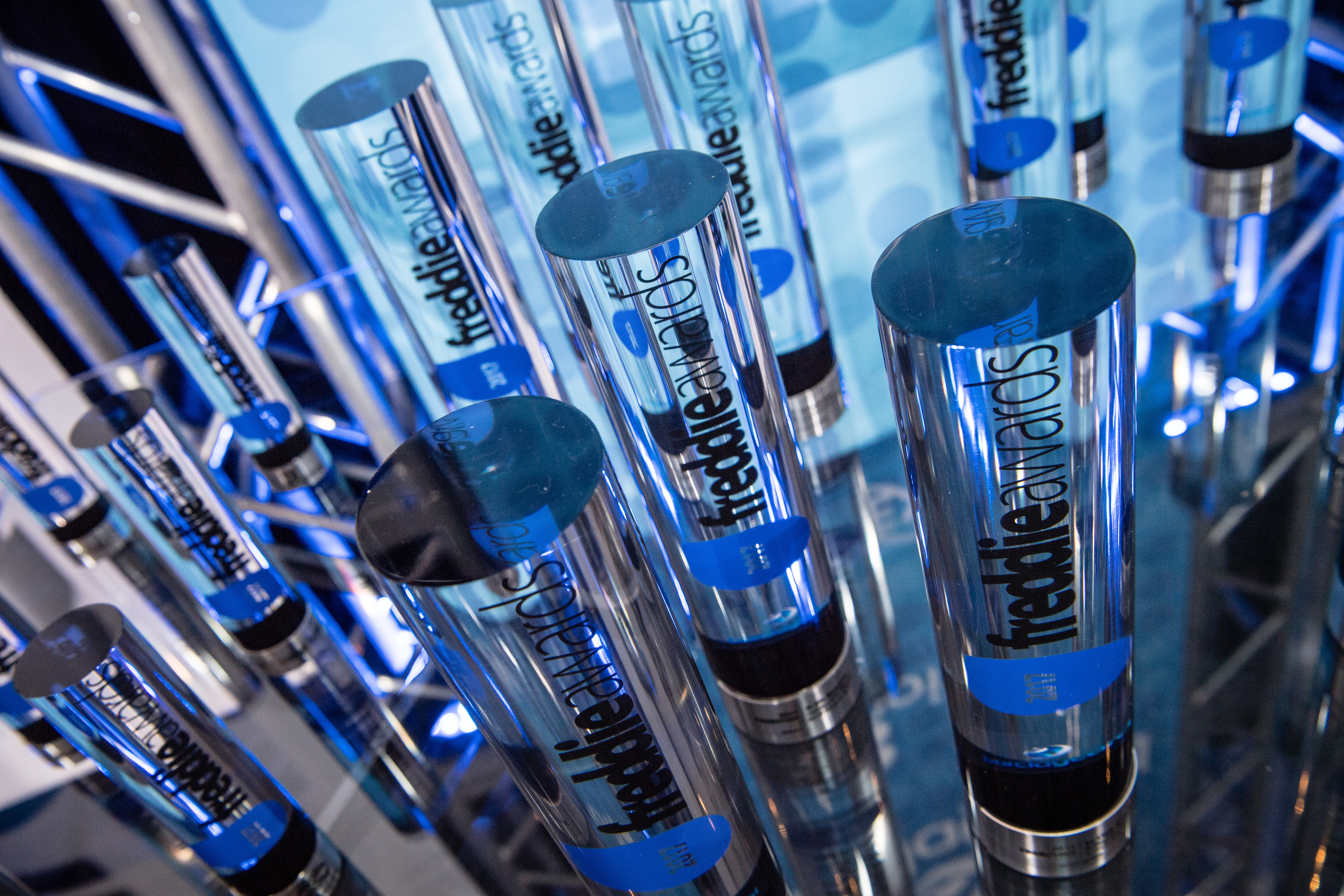 a group of glass tubes with blue text
