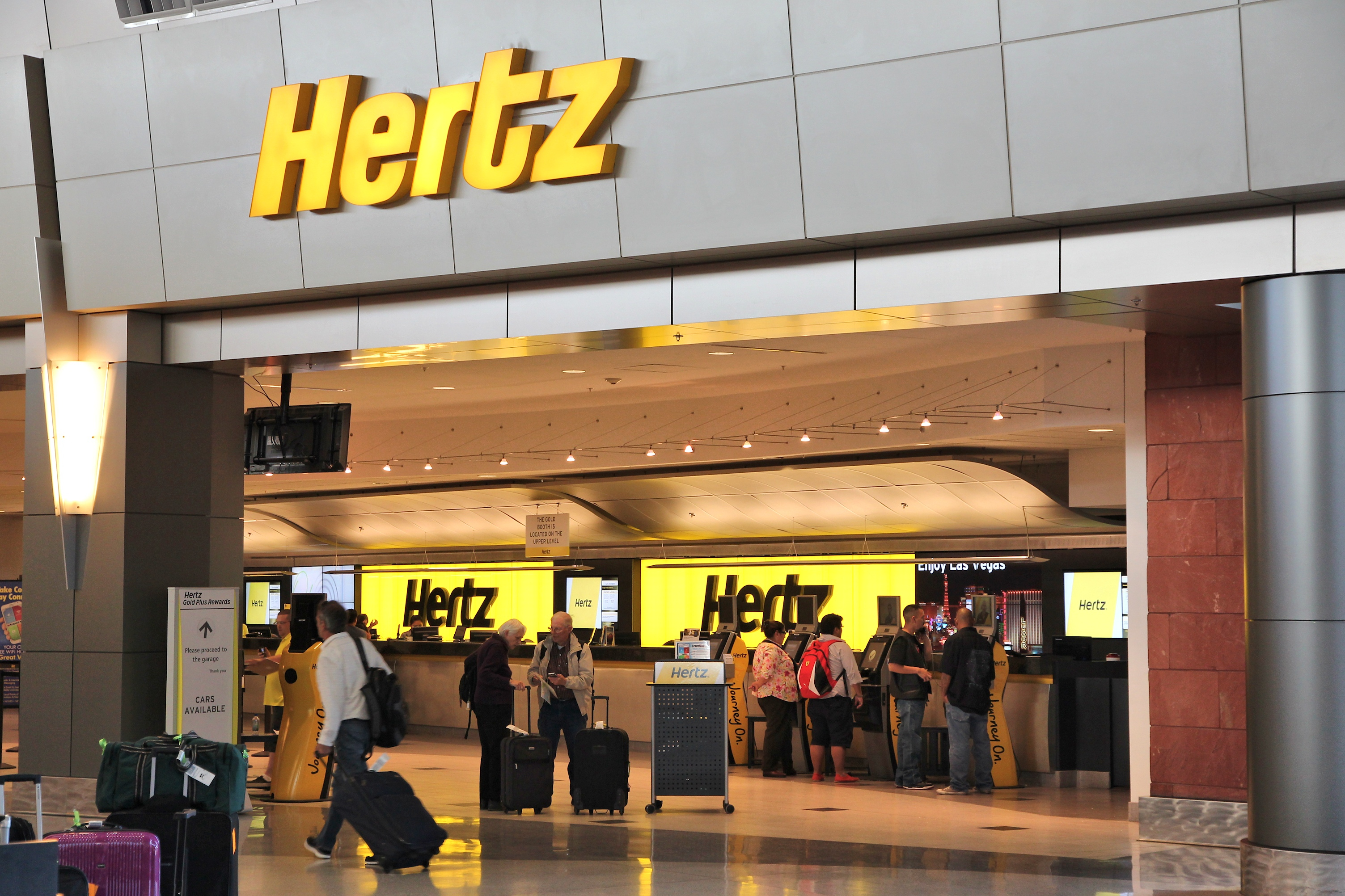 people standing in front of a check-in counter