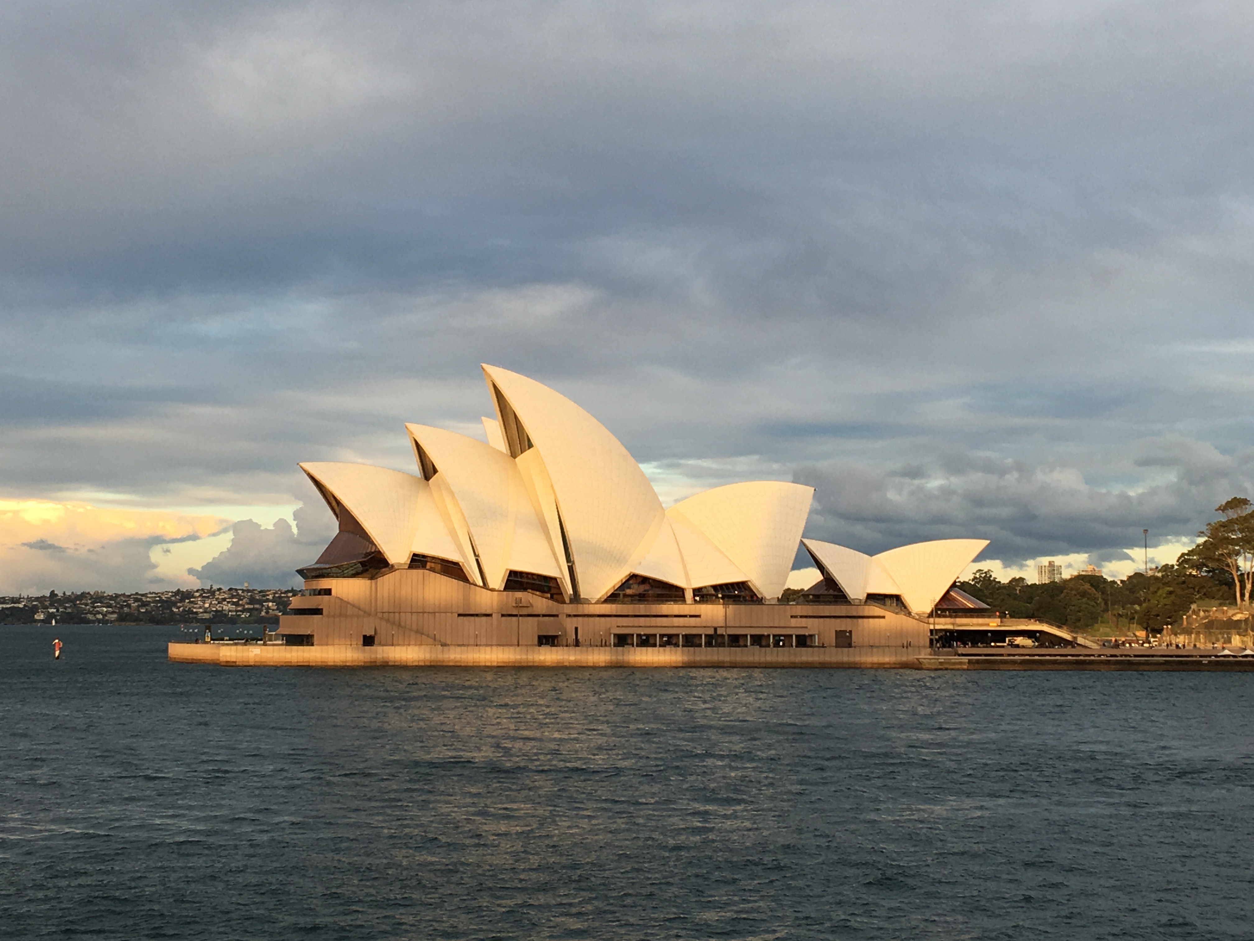 Sydney Opera House with white roof on water