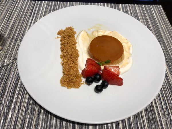 a plate of dessert on a striped surface