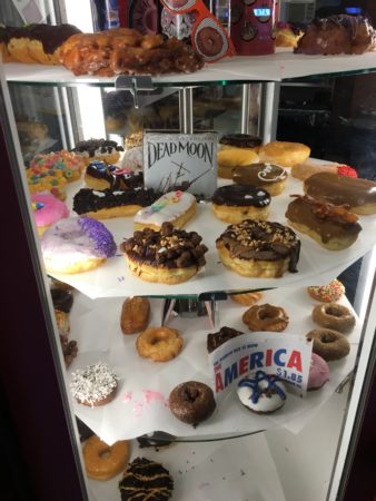 a display case with various donuts