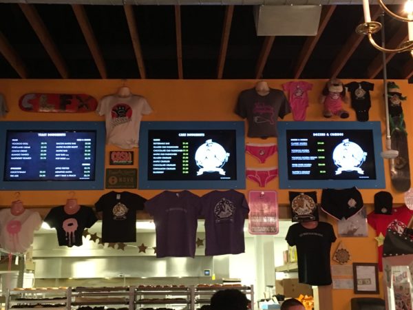 a display of t-shirts on a wall