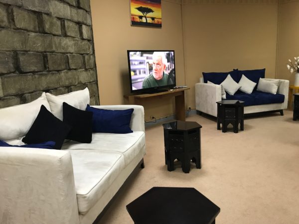 a room with couches and a television