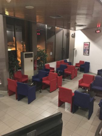 a room with red and blue chairs