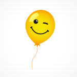 a yellow balloon with a face drawn on it