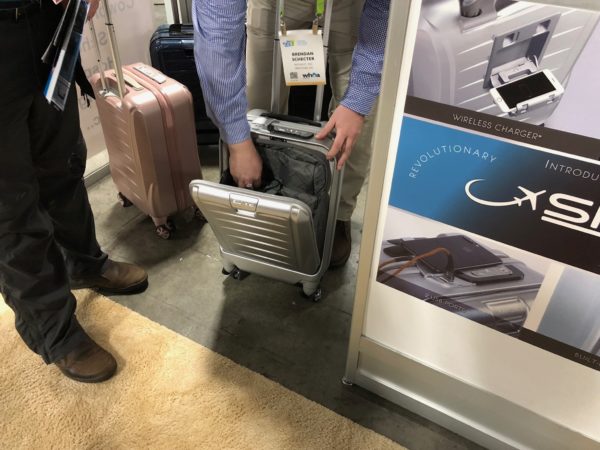 a person holding a suitcase