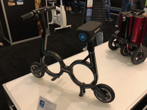a black and blue scooter on a white surface