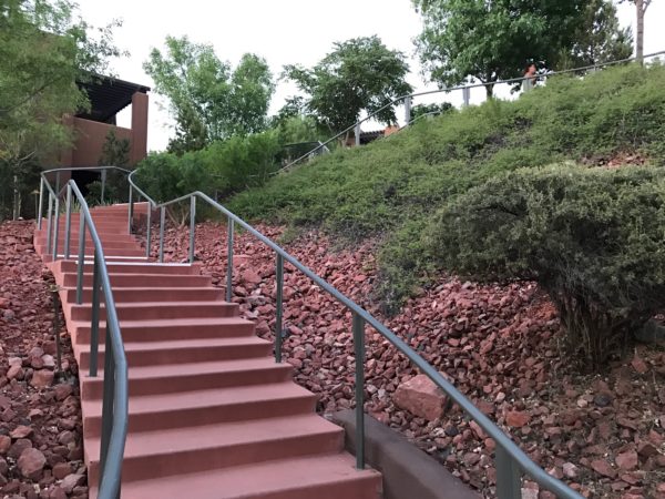 a staircase outside with a metal railing