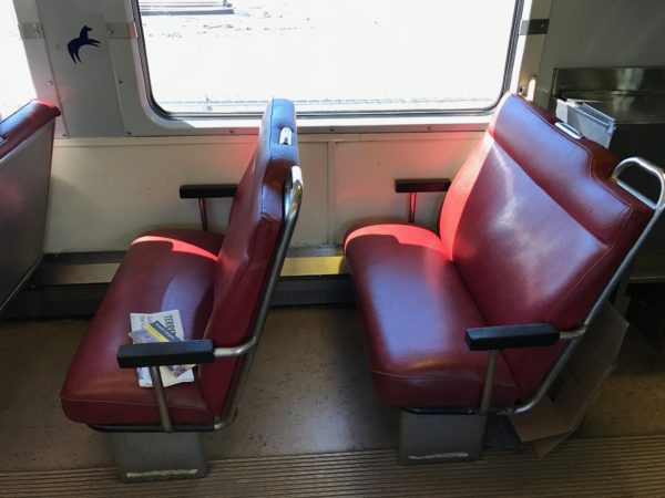 two red seats in a train