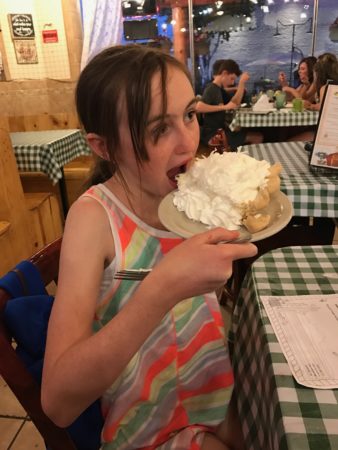 a girl eating a cake