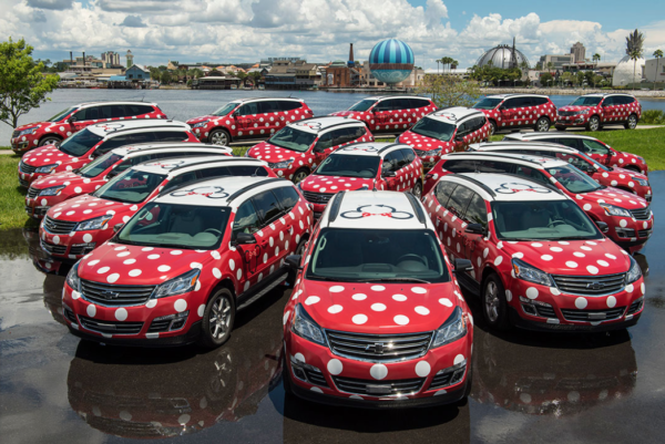a group of red and white cars with white dots
