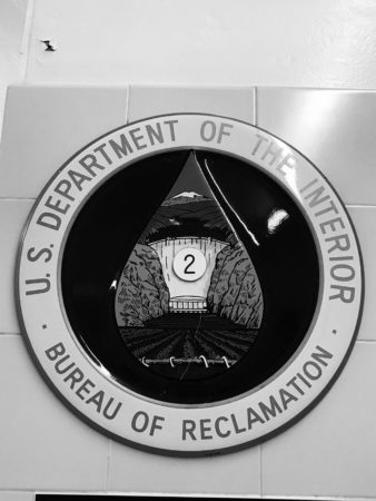 a black and white circular emblem