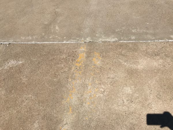 a concrete surface with a shadow
