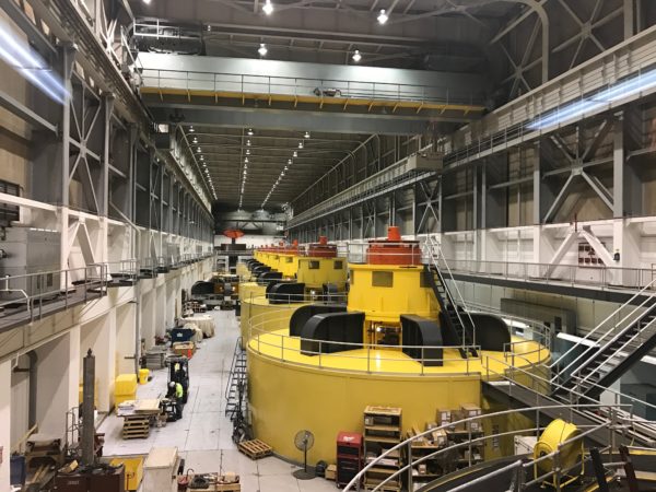 a large factory with yellow machines