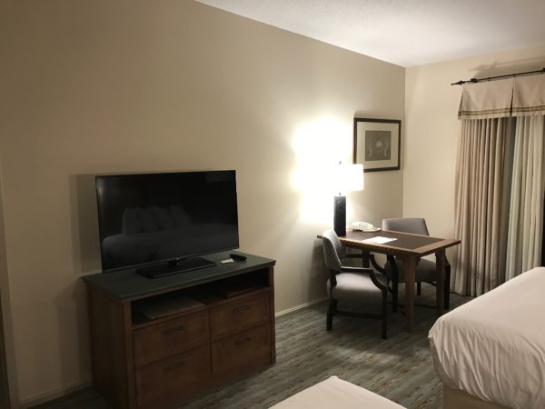a room with a tv and a table