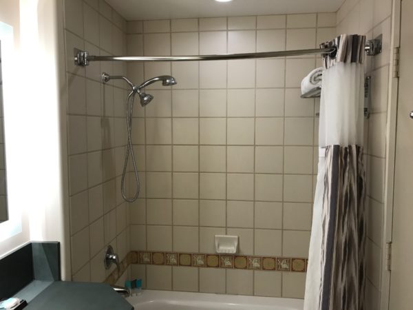 a shower head and tub in a bathroom