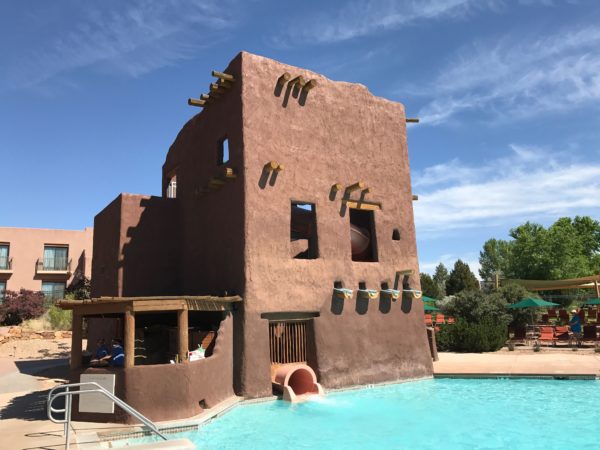 a building with a slide in the water