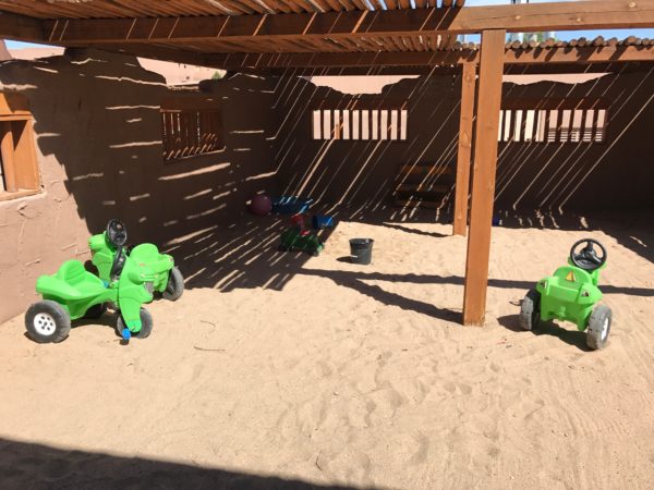 a group of toys in sand