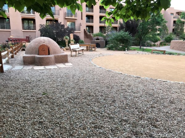 a stone structure in a courtyard