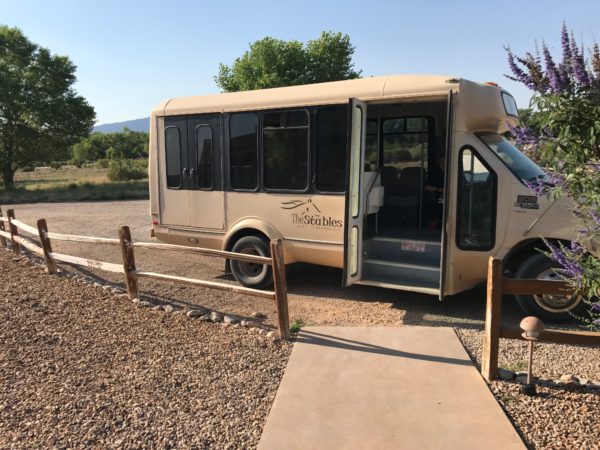 a bus parked on gravel