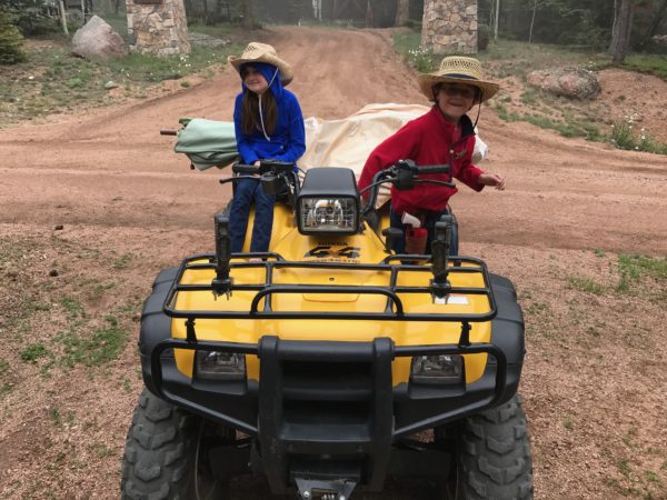 two children on a atv
