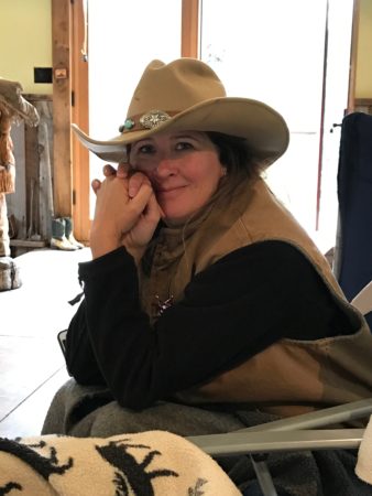 a woman in a cowboy hat