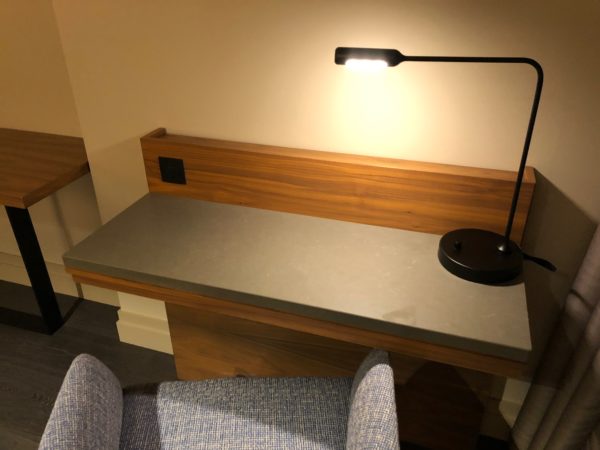 a desk with a lamp on it