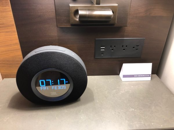 a digital alarm clock on a counter