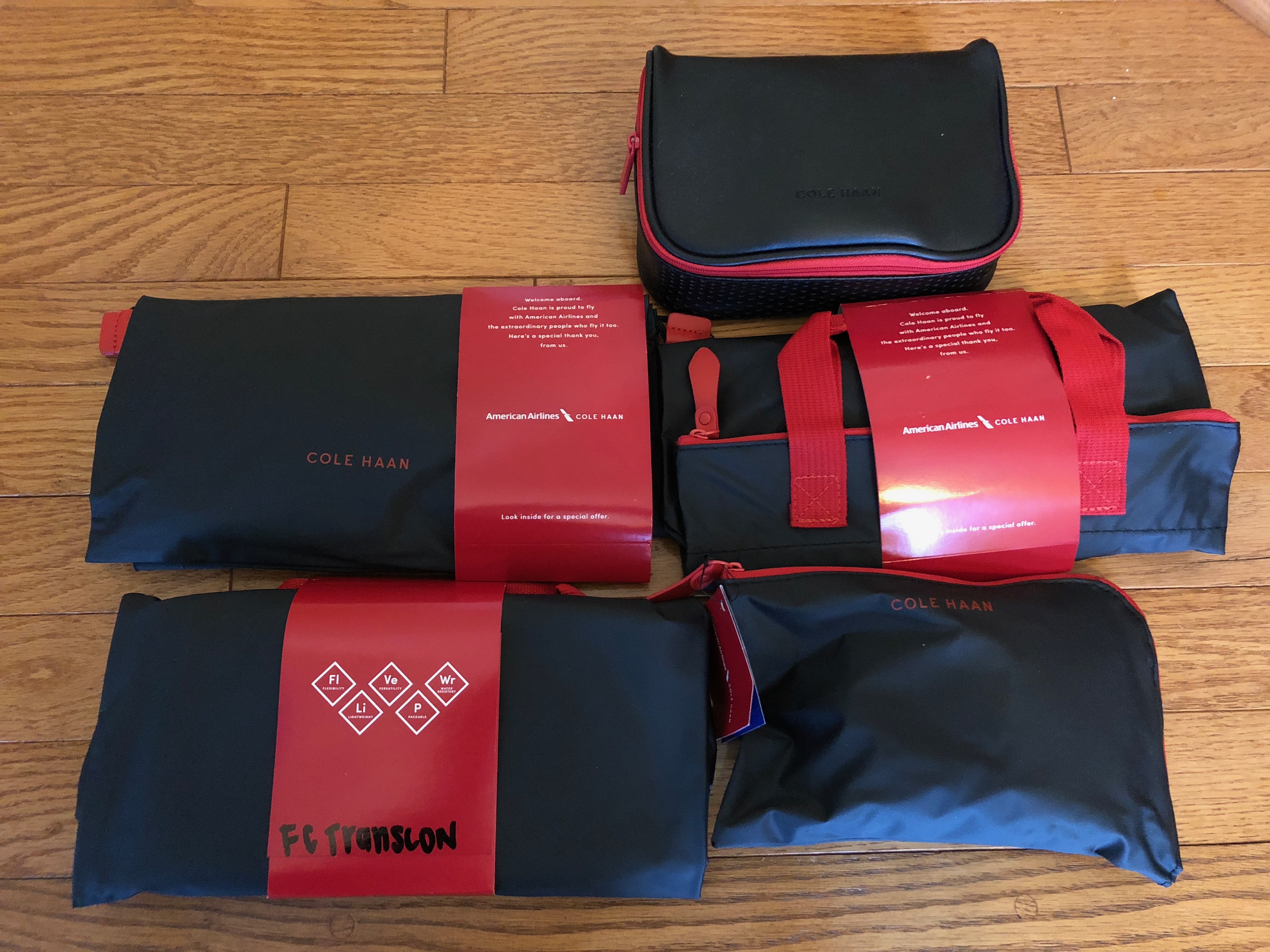 a group of black and red bags