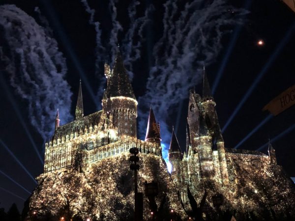 a castle with lights and fireworks