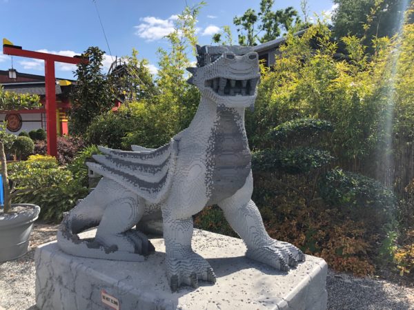 a statue of a dragon made of lego