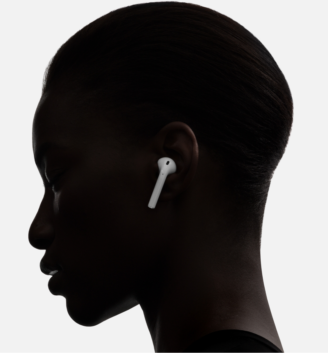 a profile of a woman with earphones