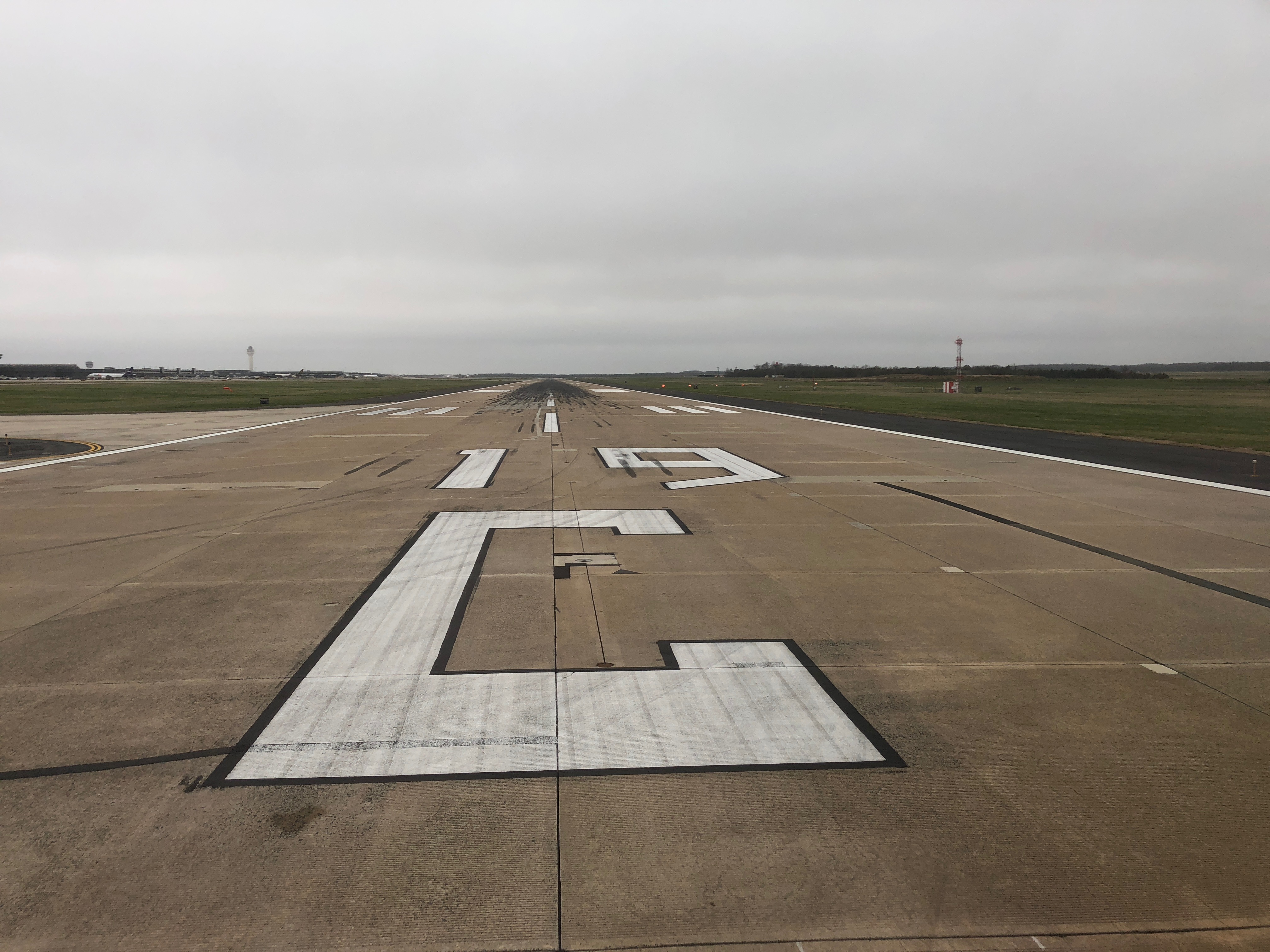 a runway with white markings on it