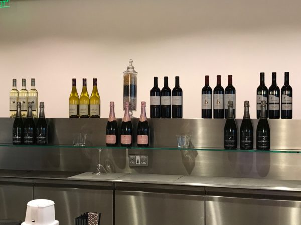 a group of bottles of wine on a shelf