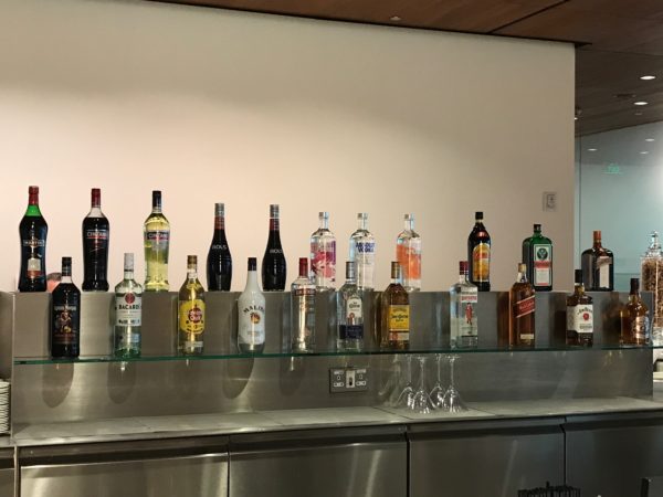 a group of bottles of alcohol on a shelf