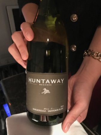a person holding a bottle of wine