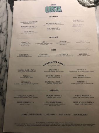 a menu on a marble surface