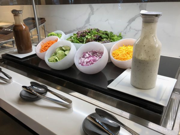 a salad bar with different salads