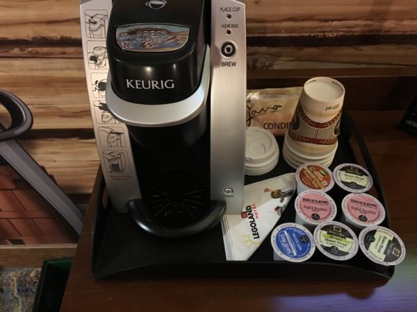 a coffee maker and a tray of k-cups