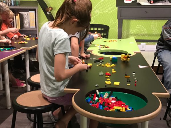 a group of kids playing with legos